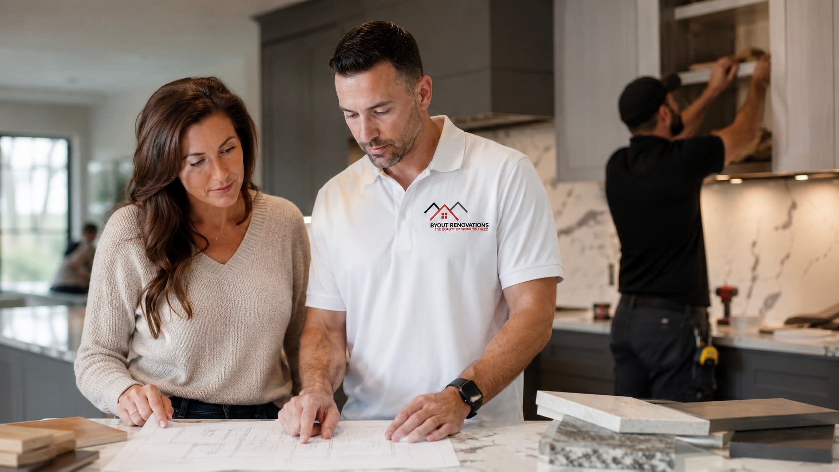 Byout Renovations contractor reviewing renovation plans with a homeowner