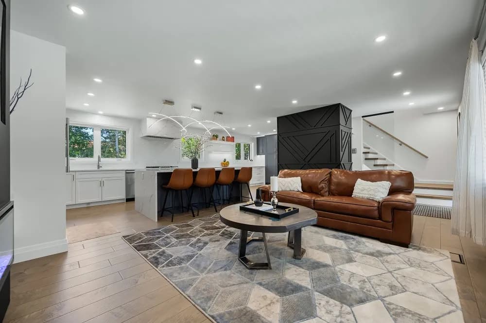 Open-concept finished basement suite with kitchen island and modern finishes in a Niagara Region home
